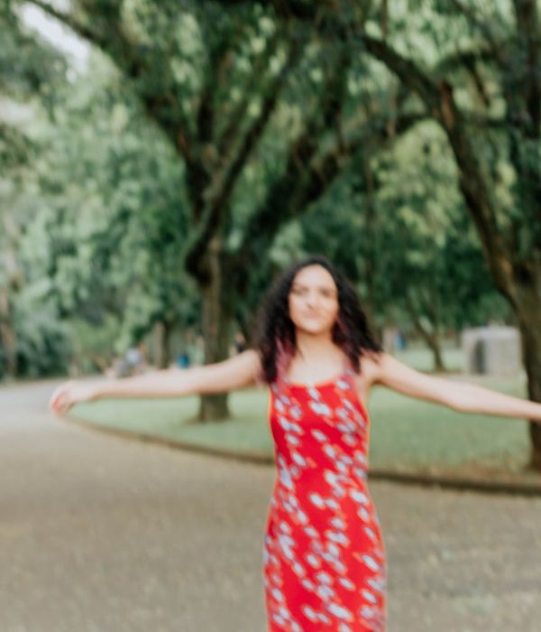 Woman feeling energetic and full of life in a natural setting.